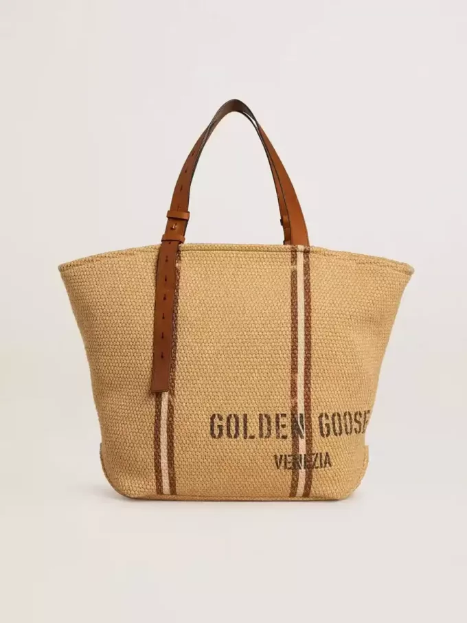 24,7 tote bag i naturlig raffia och brunt läder med guldmetalliska detaljer