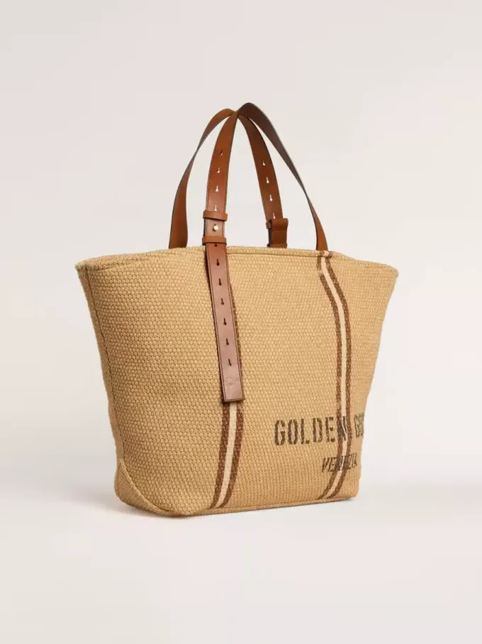 24,7 tote bag i naturlig raffia och brunt läder med guldmetalliska detaljer