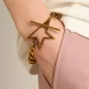 Armband i antikguld med avtagande kedja och stjärnformat lås