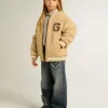 Beige bomberjacka i fleece för barn