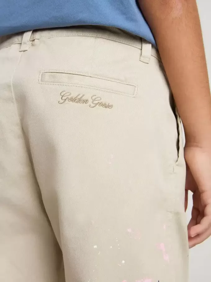Beige chinosbyxor för barn med flerfärgade stänk