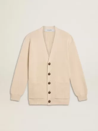 Beige damkofta med texten ”Golden” på ryggen