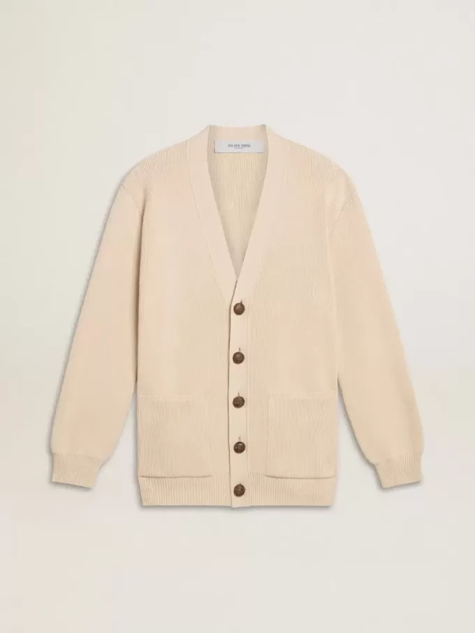 Beige damkofta med texten ”Golden” på ryggen Beige damkofta med texten ”Golden” på ryggen