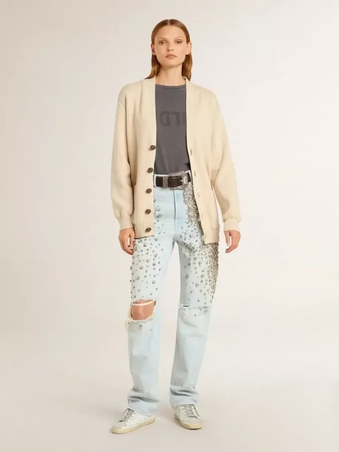 Beige damkofta med texten ”Golden” på ryggen Beige damkofta med texten ”Golden” på ryggen