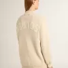Beige damkofta med texten ”Golden” på ryggen Beige damkofta med texten ”Golden” på ryggen