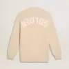 Beige damkofta med texten ”Golden” på ryggen Beige damkofta med texten ”Golden” på ryggen