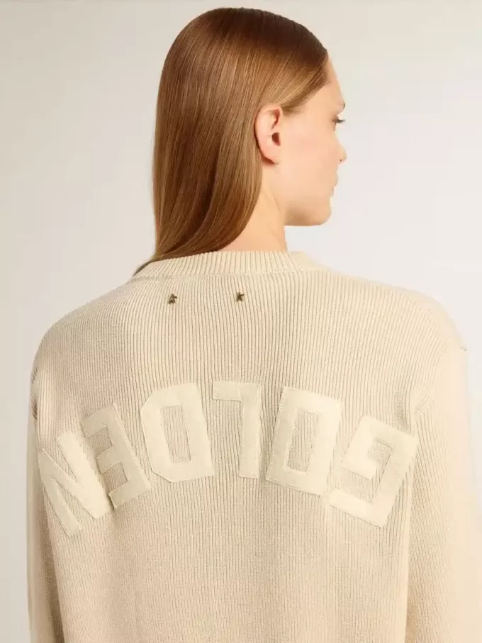 Beige damtröja med texten ”Golden” på ryggen Beige damtröja med texten ”Golden” på ryggen