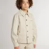 Beige jacka för barn med flerfärgade stänk