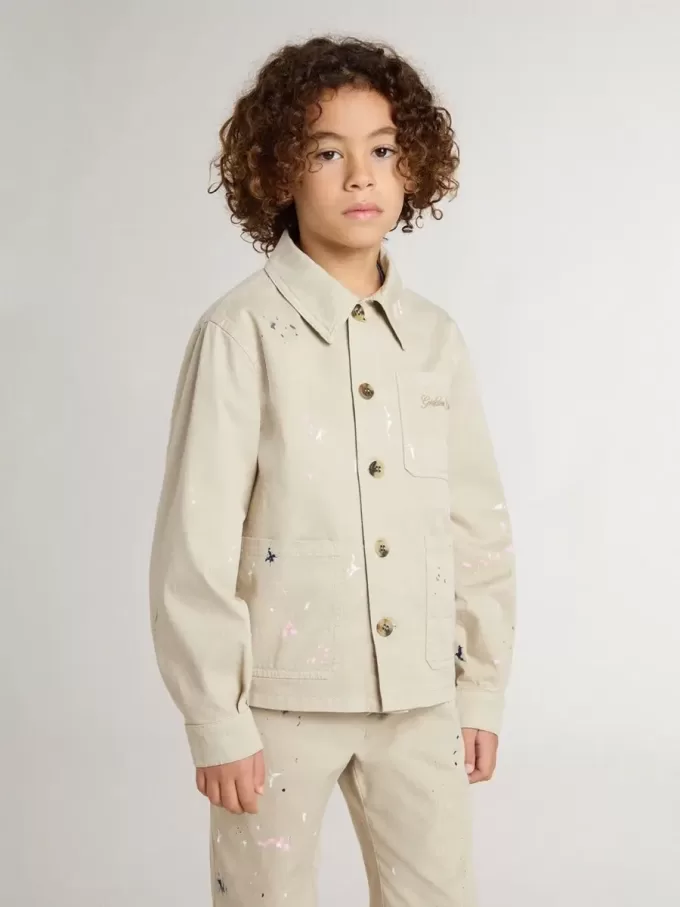 Beige jacka för barn med flerfärgade stänk