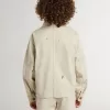 Beige jacka för barn med flerfärgade stänk