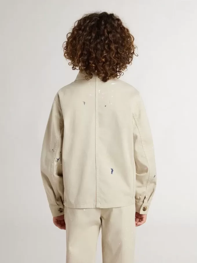 Beige jacka för barn med flerfärgade stänk