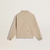 Beige jacka för barn med flerfärgade stänk