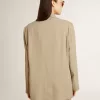 Beige randig enkelknäppt jacka för damer med oversized passform Beige randig enkelknäppt jacka för damer med oversized passform