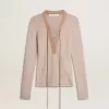 Beige ulltröja med läderdetaljer Beige ulltröja med läderdetaljer