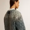 Blå quiltad jacka för dam i bomullsdenim med slitna detaljer