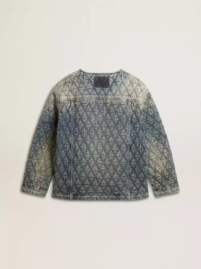 Blå quiltad jacka för dam i bomullsdenim med slitna detaljer
