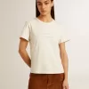 Dam-T-shirt i åldrad vit bomull med tryck och broderi