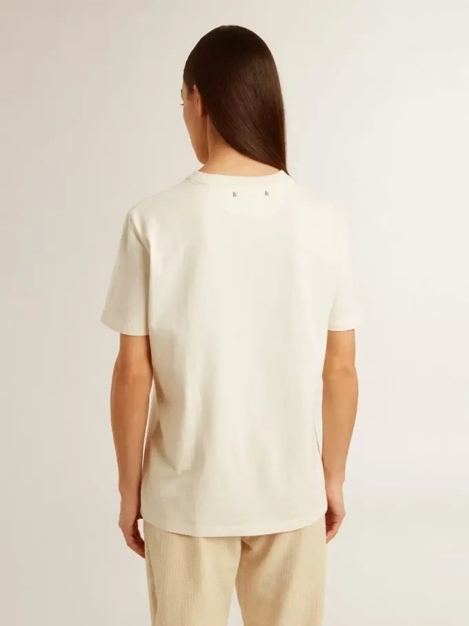 Dam-T-shirt i åldrat vitt med logotyp på bröstet