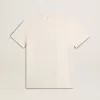 Dam-T-shirt i åldrat vitt med logotyp på bröstet