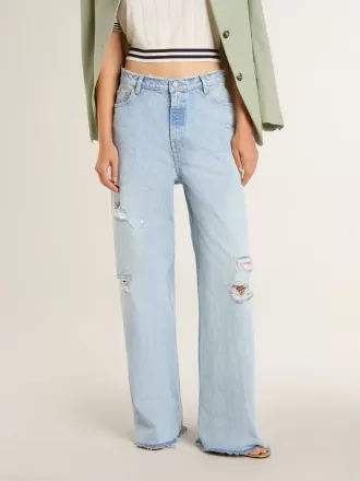 Dambyxor i denim med sliten effekt