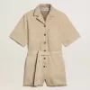 Damromper i beige denim med bälte och slitna kanter