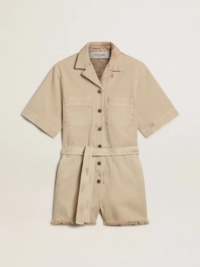 Damromper i beige denim med bälte och slitna kanter