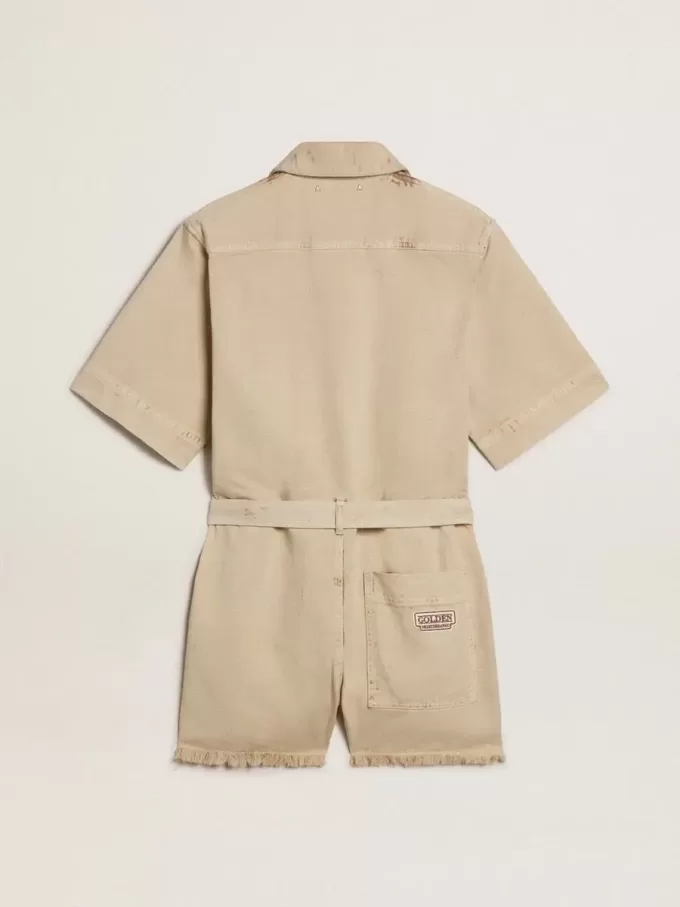 Damromper i beige denim med bälte och slitna kanter