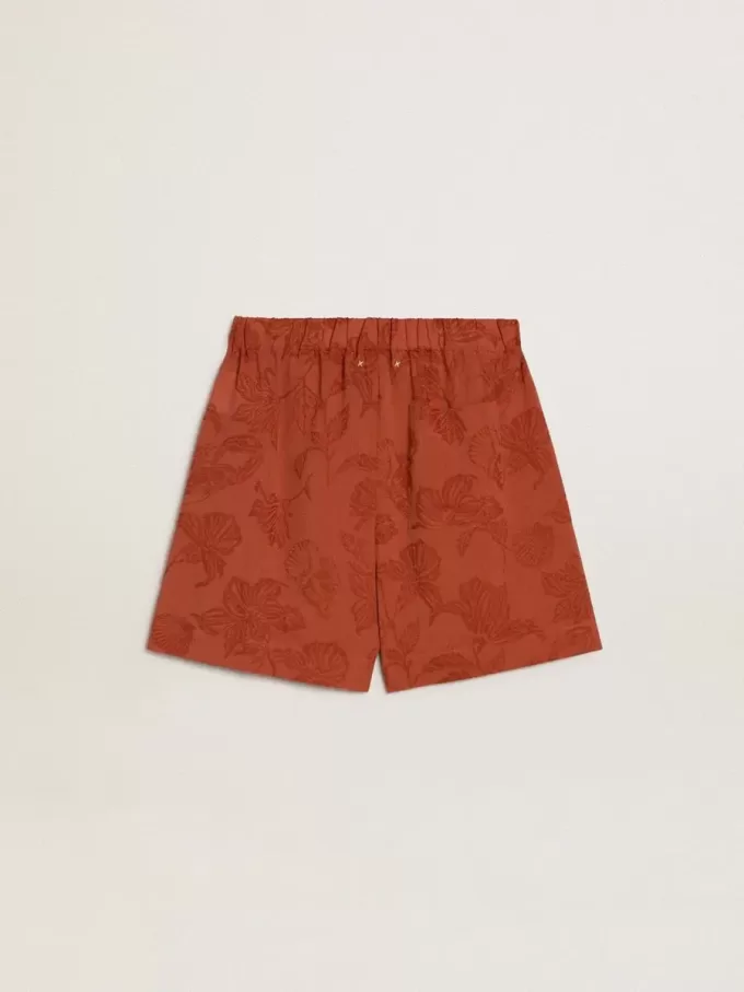 Damshorts i tegelröd jacquard med marint blommönster
