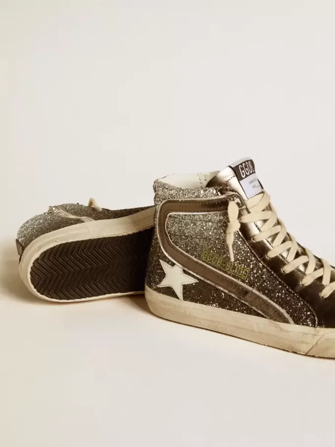 Damsko i svart och silverglitter med läderstjärna och metallisk glans