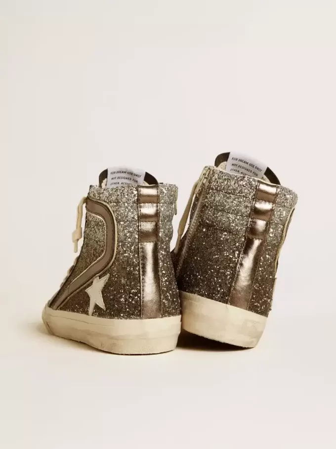 Damsko i svart och silverglitter med läderstjärna och metallisk glans