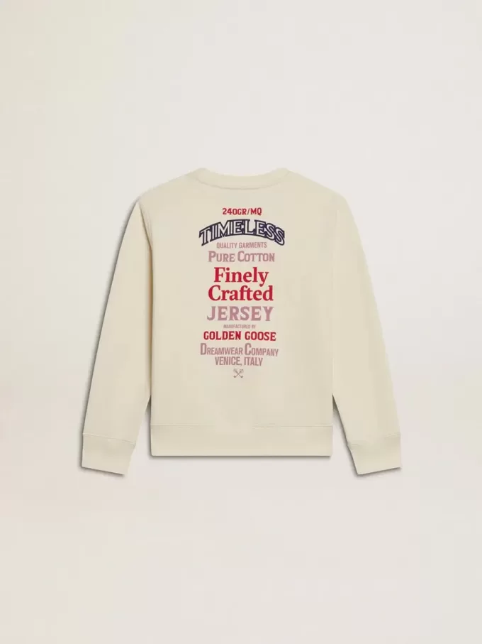 Flick-T-shirt i slitet vitt med broderi på framsidan och tryck på baksidan
