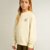 Flick-T-shirt i slitet vitt med broderi på framsidan och tryck på baksidan