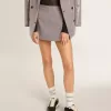Grå minishorts för dam i hundtandsmönstrad ull Grå minishorts för dam i hundtandsmönstrad ull