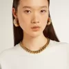 Halsband i antikguld med avtagande kedja och stjärnformad lås Halsband i antikguld med avtagande kedja och stjärnformad lås