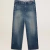 Herrchinos i denim med slitna detaljer