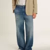 Herrchinos i denim med slitna detaljer