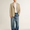 Herrchinos i denim med slitna detaljer