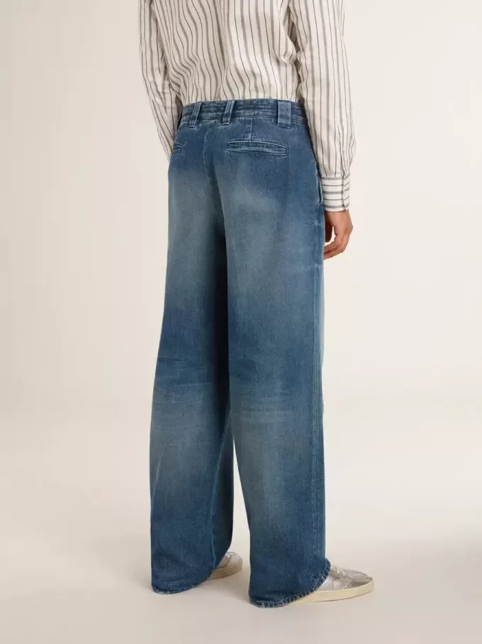 Herrchinos i denim med slitna detaljer