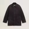 Herrjacka i denim med slitna detaljer och läderkrage Herrjacka i denim med slitna detaljer och läderkrage