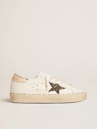 Hi Star LTD med svart och guldglittrande stjärna och guldfärgad hälflik