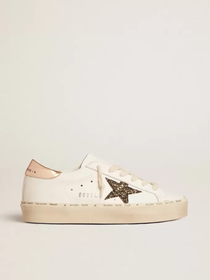 Hi Star LTD med svart och guldglittrande stjärna och guldfärgad hälflik Hi Star LTD med svart och guldglittrande stjärna och guldfärgad hälflik