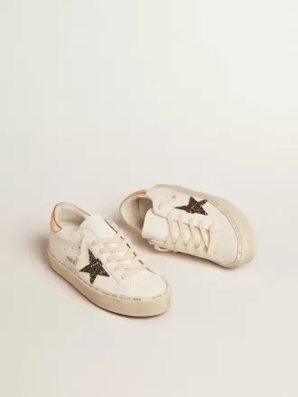 Hi Star LTD med svart och guldglittrande stjärna och guldfärgad hälflik