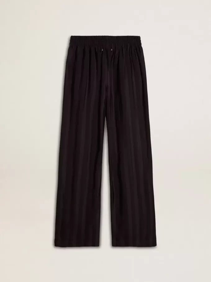 Joggingbyxor för damer med slits vid ankeln Joggingbyxor för damer med slits vid ankeln