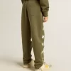 Joggingbyxor för pojkar i militärgrön färg med vita stjärnor Joggingbyxor för pojkar i militärgrön färg med vita stjärnor