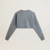 Kort sweatshirt i babyblått med slitna detaljer