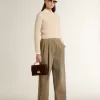 Kortare tröja med rund hals i beige ull med kristaller över hela ytan Kortare tröja med rund hals i beige ull med kristaller över hela ytan