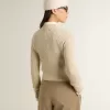 Kortare tröja med rund hals i beige ull med kristaller över hela ytan Kortare tröja med rund hals i beige ull med kristaller över hela ytan