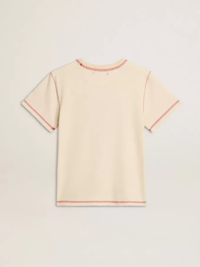 Krämefärgad dam-T-shirt med blekta röda accenter Krämefärgad dam-T-shirt med blekta röda accenter