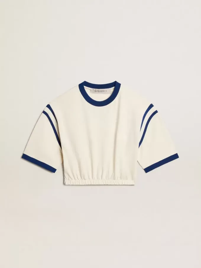 Åldrad vit bomullst-shirt med text på baksidan Åldrad vit bomullst-shirt med text på baksidan