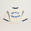 Åldrad vit bomullst-shirt med text på baksidan Åldrad vit bomullst-shirt med text på baksidan